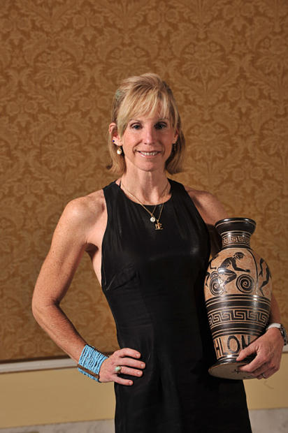 Eight-time Ironman Hawaii winner Paula Newby-Fraser with her USAT 2010 Hall...
