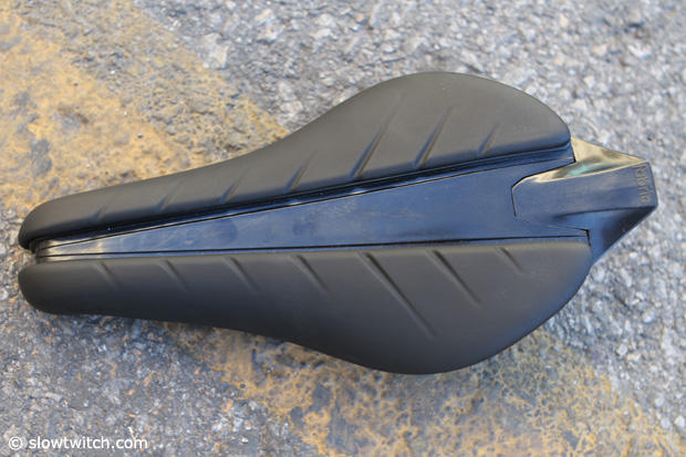 Fabric triathlon saddle with a deep groove down the center