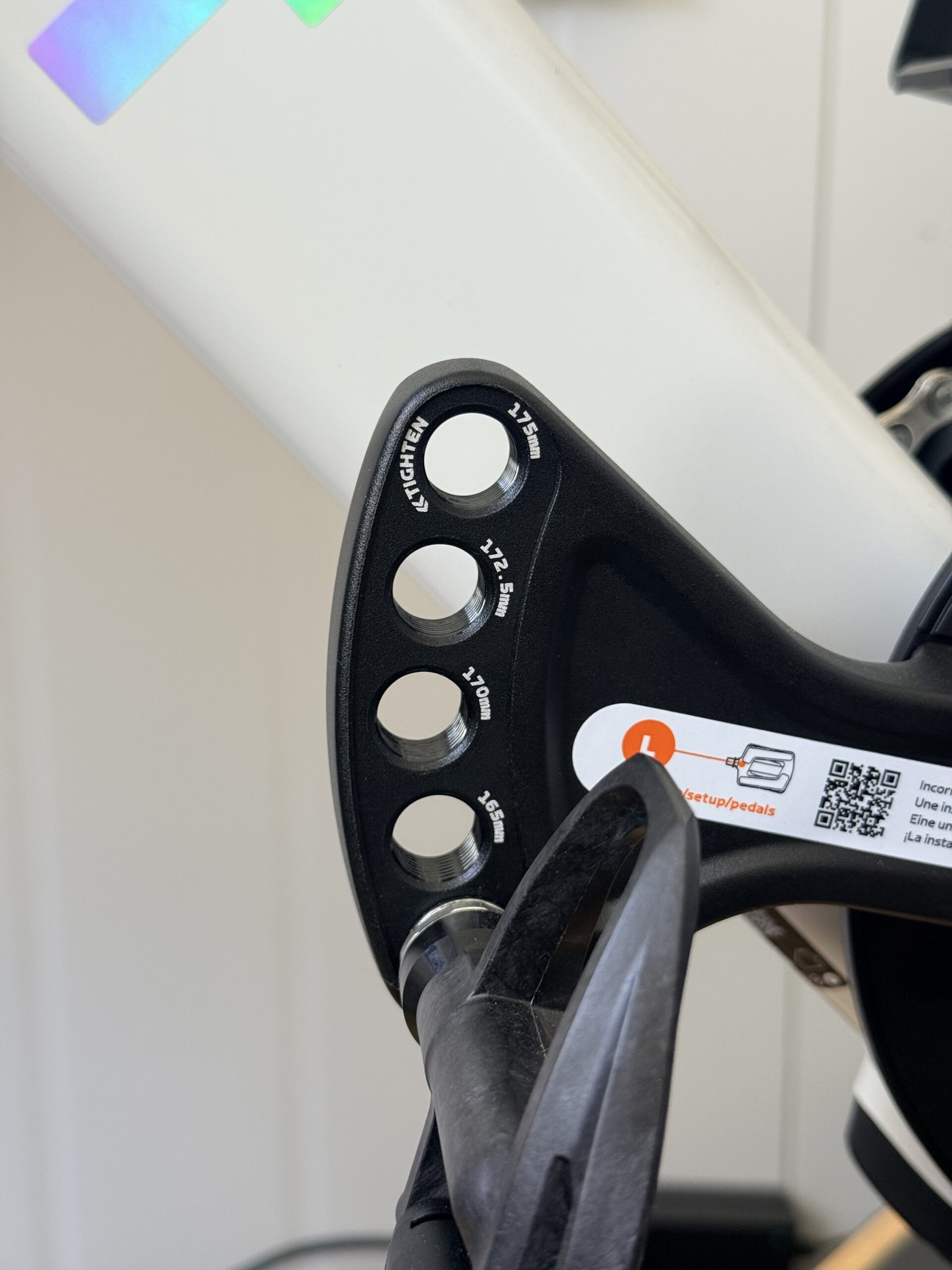 Close-up of the Zwift Ride adjustable crank arm showing labeled pedal positions from 160mm to 175mm