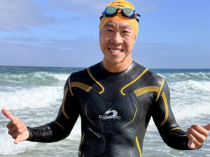 Sumarpo Victory Men's Eco triathlon wetsuit, front view at La Jolla Shores in San Diego, California