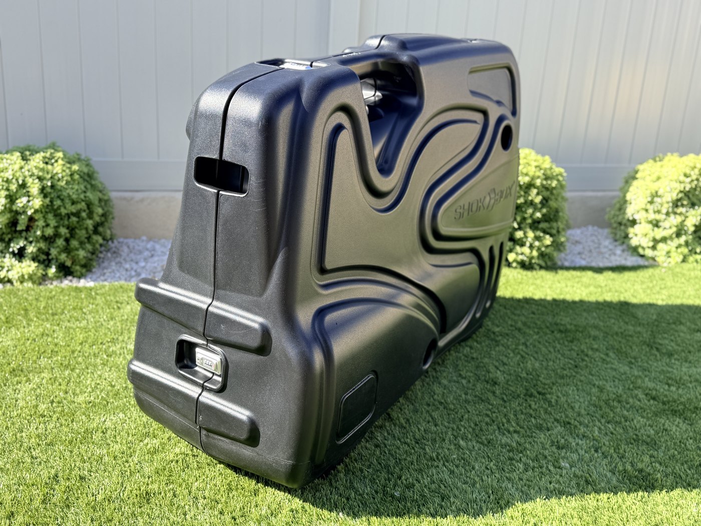 Shokbox Pro bike travel case standing upright, three-quarter view